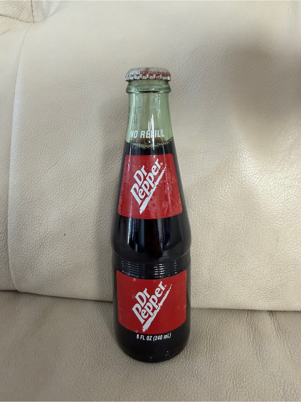 vintage 8-ounce Dr Pepper glass bottle produced around the mid-1990s